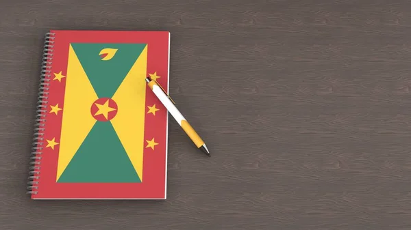 Üzerinde Grenada Bayrağı Yalancı Bir Kalem Olan Bir Defter — Stok fotoğraf