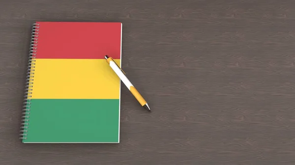 Notebook Flag Guinea Lying Pen — стоковое фото