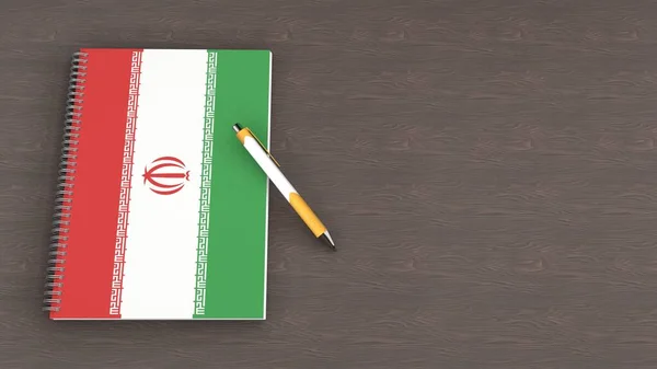 Üzerinde İran bayrağı ve yalancı bir kalem olan bir defter.
