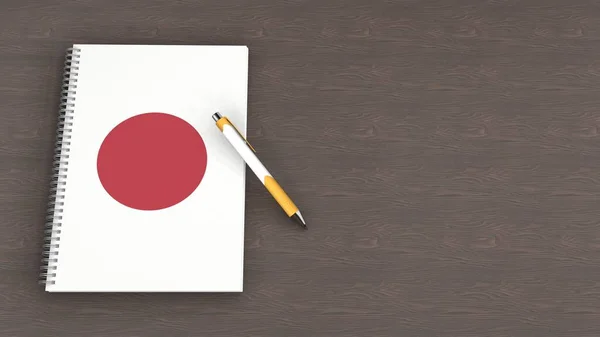 Japon bayrağı ve yalancı bir kalemin olduğu bir defter.