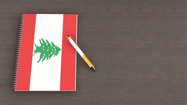 Lübnan bayrağı ve yalancı bir kalemin olduğu bir defter.