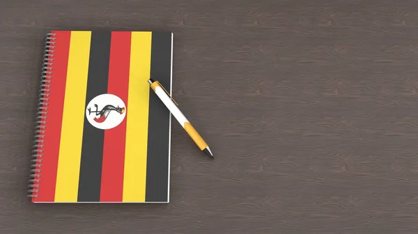Notebook Flag Uganda Lying Pen — стоковое фото