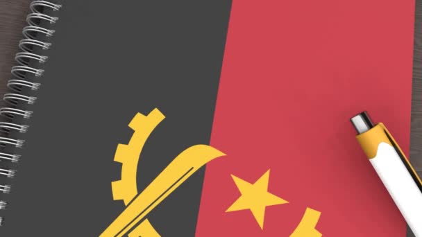 Notebook Flag Angola Lying Pen — Vídeo de Stock