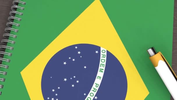 Notebook Flag Brazil Lying Pen — Vídeo de Stock