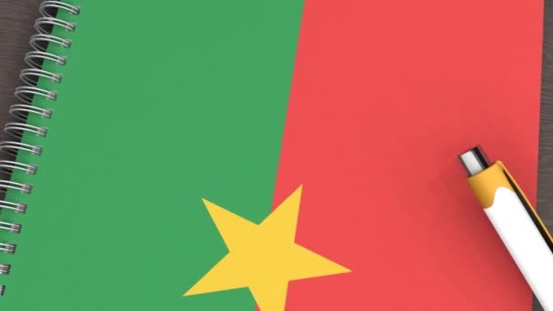 Notebook Flag Burkina Faso Lying Pen — Vídeo de Stock