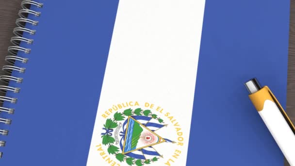 エルサルバドルの旗と嘘のペンのあるノート — ストック動画