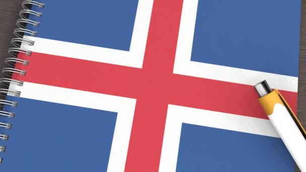 Ένα Σημειωματάριο Σημαία Της Ισλανδίας Και Ένα Στυλό Που Βρίσκεται — Αρχείο Βίντεο