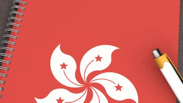 Cuaderno Con Bandera Hong Kong Una Pluma Mentirosa — Vídeos de Stock