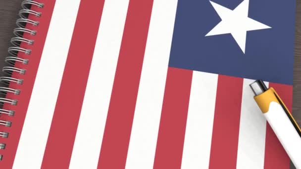 Notebook Flag Liberia Lying Pen — Vídeo de Stock