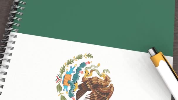 Ένα Σημειωματάριο Σημαία Του Μεξικού Και Ένα Στυλό Που Βρίσκεται — Αρχείο Βίντεο