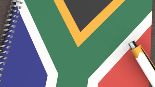 Notebook Flag South Africa Lying Pen — стоковое видео