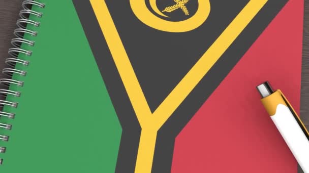 Een Notitieboekje Met Vlag Van Vanuatu Een Liggende Pen — Stockvideo