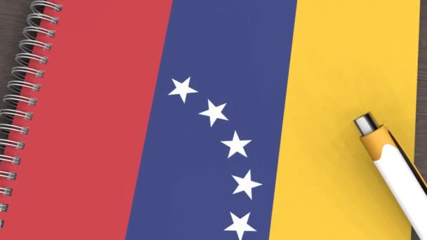 Notebook Flag Venezuela Lying Pen — стоковое видео