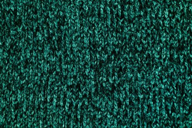 Örgü iğnelerinin ipliklerinden örülmüş sıcak süveter, güzel yeşil renk..