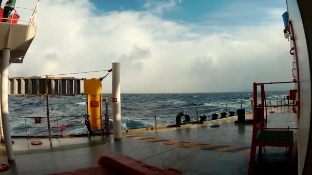 View from the cargo vessel ship going far away in ocean from the board — стоковое видео