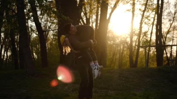 Man and woman at sunset. A romantic date and love on nature of loving happy couple. Dancing and fooling couple in forest at sunset — Stock Video