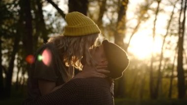 Slow motion Close up portrait of a beautiful young couple waiting to kiss in their traveling time against sunset light