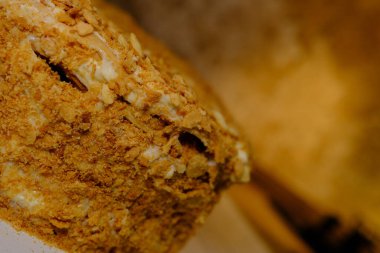 Board with delicious Napoleon cake, close up with selective blur.