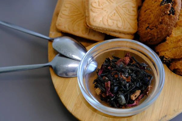 Dried Tea Leaves Tea Pot Cookies Gray Table Spoons Wooden — Foto de Stock