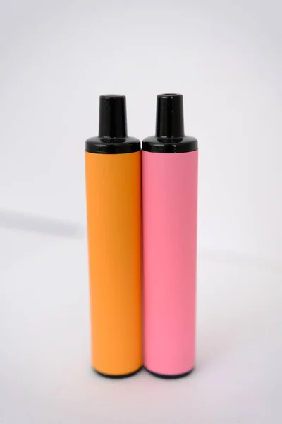 Pink Orange Disposable Electronic Cigarettes White Background Copy Space — Zdjęcie stockowe