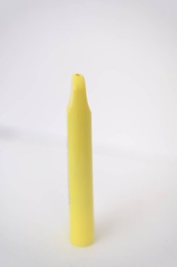 yellow disposable electronic cigarette on white background. Copy space.
