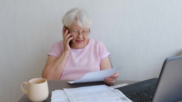 Senior Woman Holding Papers Busy Laptop Managing House Utility Bills — Video Stock