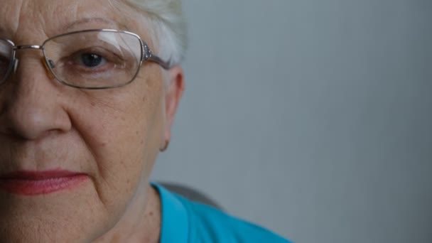 Close Portrait Senior Woman Gray Eye Looking Camera Glasses — Stock video