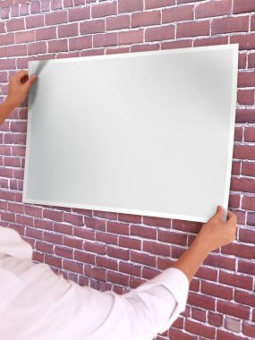 One person holding blank poster mockup