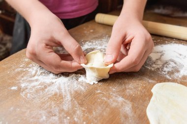 modeling of dumplings and ravioli close-up. Selective focus. home cooking in the kitchen