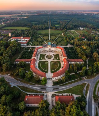 Fertod, Hungary - Aerial panoramic view of the beautiful Esterhazy Castle (Esterhazy-kastely) and garden in the Town of Fertod, near Sopron on a sunny summer morning with golden sky at sunrise