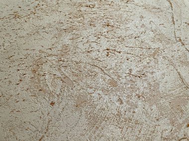 Eski duvar ufalanan alçıyla sütlü bej. Doğal arkaplan.