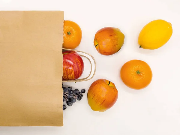 stock image A paper bag with fruit. Food delivery. An ecological product. Advertising.