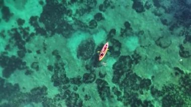 A guy sails in a kayak
