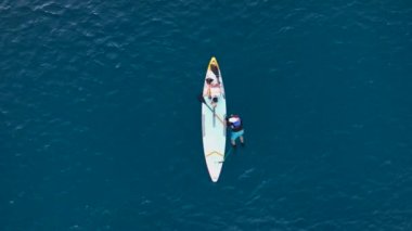 A man drifts surfing the sea