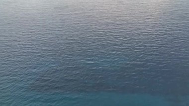 sea filmed on a drone in the sunset