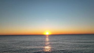 sea filmed on a drone in the sunset