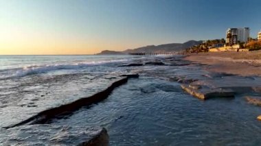sea filmed on a drone in the sunset