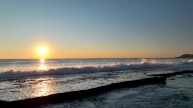sea filmed on a drone in the sunset