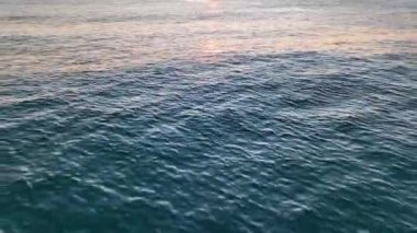 sea filmed on a drone in the sunset