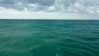 Storm at sea filmed on a drone in the sunset