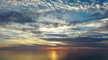 Sunset over the sea flew away on a drone in the sun