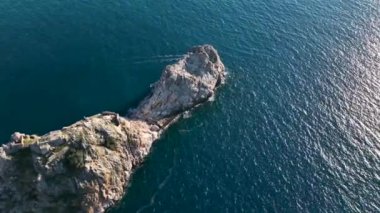 sea filmed on a drone in the sunset