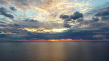 Sunset over the sea flew away on a drone in the sun