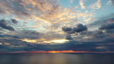 Sunset over the sea flew away on a drone in the sun