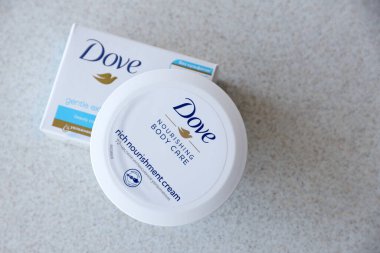 TERNOPIL, UKRAINE - APRIL 29, 2022: Production with Dove Logo on white textured surface