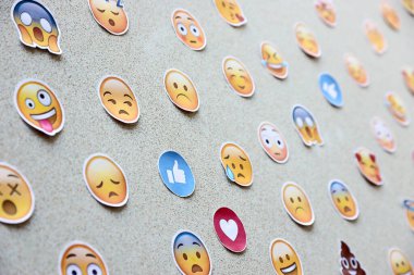 TERNOPIL, UKRAINE - APRIL 29, 2022: Large set of stickers with Emoji yellow faces. Emoji is a pictogram or smiley embedded in text and used in electronic messages and web pages
