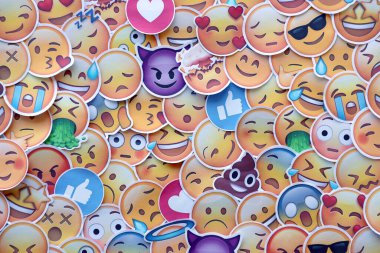 TERNOPIL, UKRAINE - APRIL 29, 2022: Large set of stickers with Emoji yellow faces. Emoji is a pictogram or smiley embedded in text and used in electronic messages and web pages