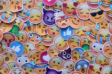 TERNOPIL, UKRAINE - APRIL 29, 2022: Large set of stickers with Emoji yellow faces. Emoji is a pictogram or smiley embedded in text and used in electronic messages and web pages