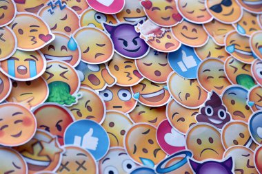 TERNOPIL, UKRAINE - APRIL 29, 2022: Large set of stickers with Emoji yellow faces. Emoji is a pictogram or smiley embedded in text and used in electronic messages and web pages