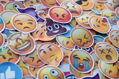 TERNOPIL, UKRAINE - APRIL 29, 2022: Large set of stickers with Emoji yellow faces. Emoji is a pictogram or smiley embedded in text and used in electronic messages and web pages